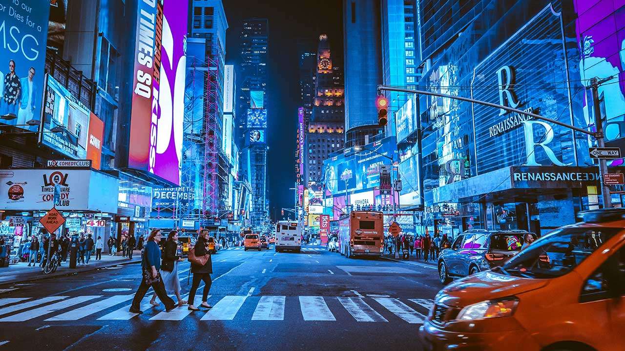 People walking on Times Square during night time