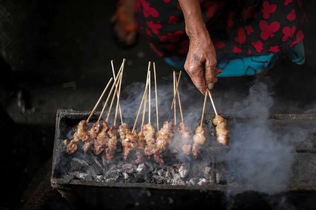 Close-up of traditional grilled Goat Satay in Java, Indonesia.