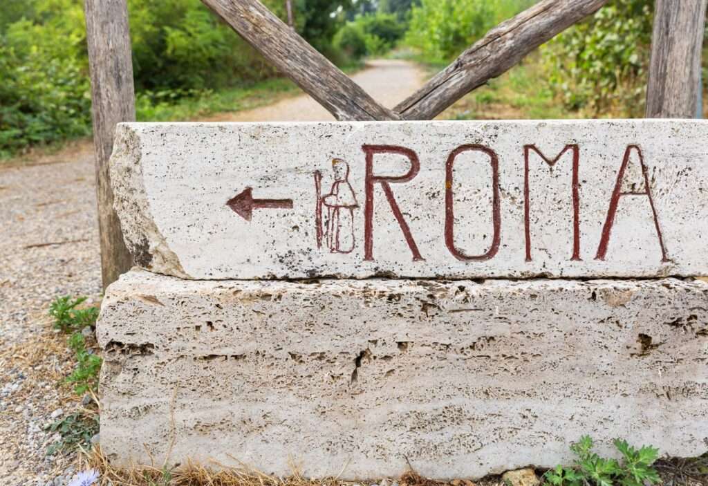 Pilgrim's route Via Francigena waymarker showing the direction to Rome