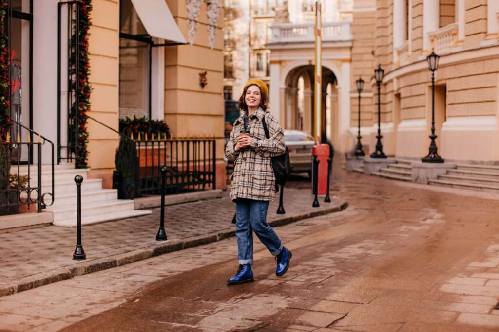 Portrait female student walking city center