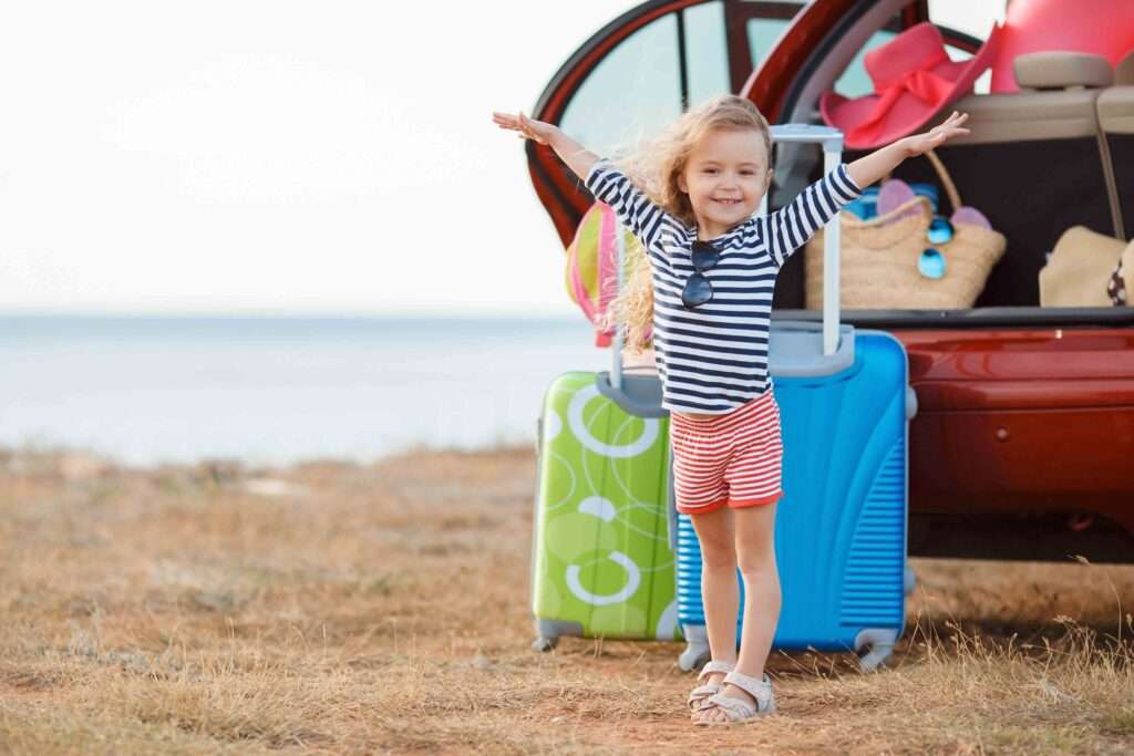 Happy little girl going travel