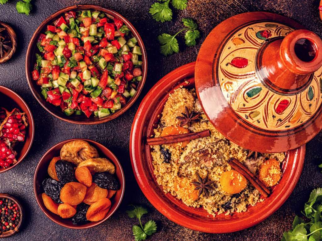 Traditional moroccan tajine of chicken with dried fruits and spi