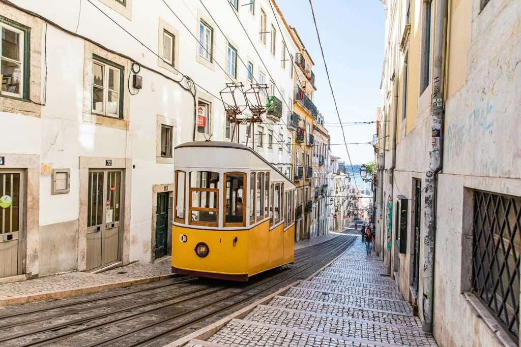 Historic Tram 28 climbing from Graça to Baixa, Lisbon.