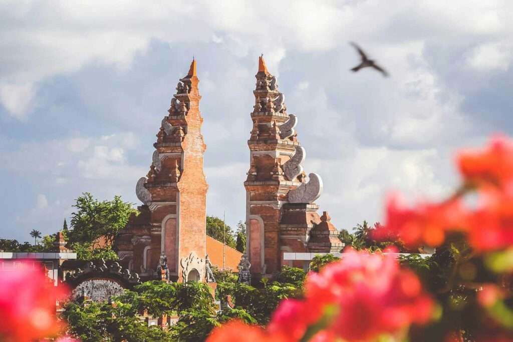 Temple in bali, Indonesia with flowers in foreground