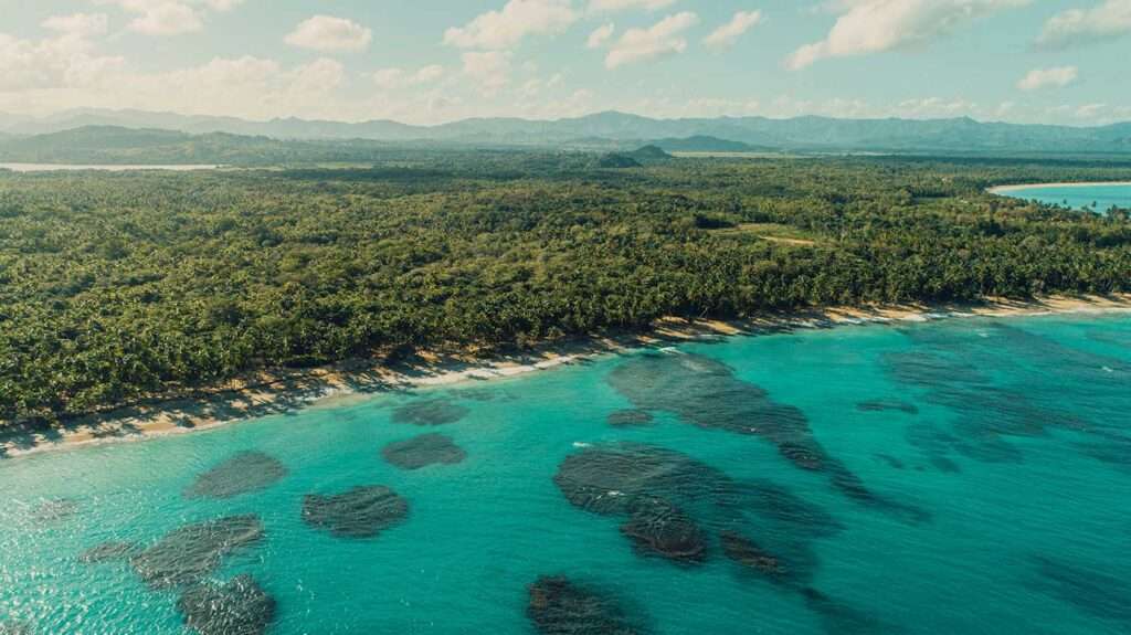 Aerial view of a crystal-clear beach in the Dominican Republic